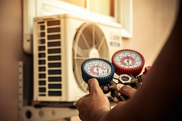 Professional Air Conditioning Service technician working in Clifton, TN